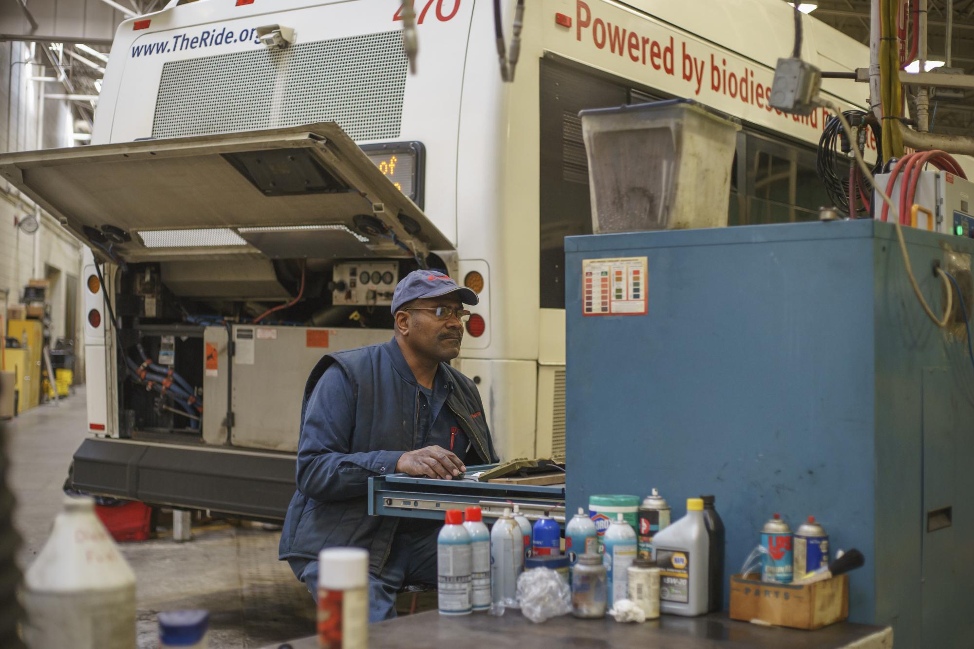 Bus maintenance engineer working in the garage