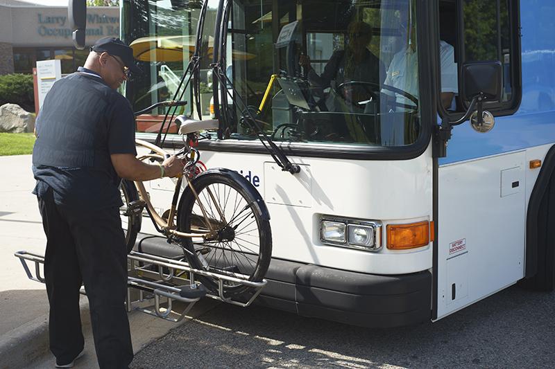 Rider using bike rack on bus