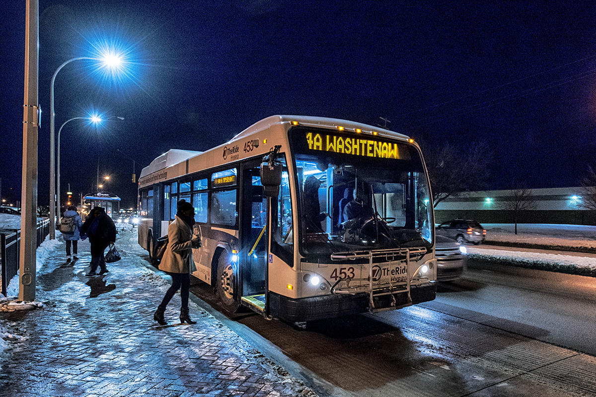 TheRide bus traveling at night in winter
