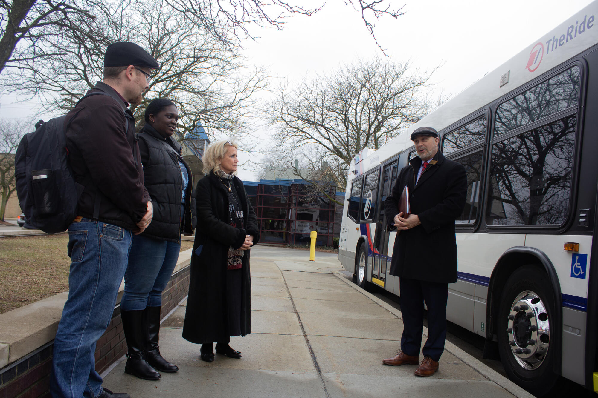 CEO Matt Carpenter speaks with Congresswoman Dingell, Mayor Brown of Ypsilanti and TheRide Board Member Jesse Miller about the Ypsilanti Transit Center project.