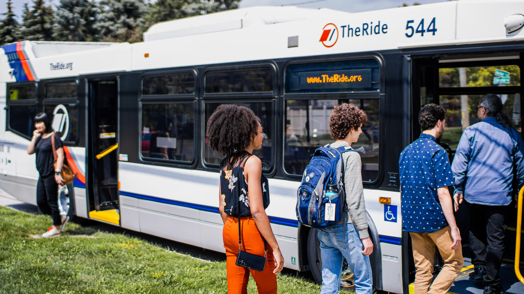 photo of riders boarding a bus