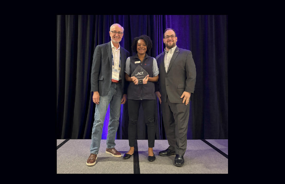 Lilliane Webb (middle) accepted the award on behalf of TheRide/getDowntown program. She is pictured with: Thom Cerny, ACT Treasurer (left) and David Stauss, ACT Executive Director (right)