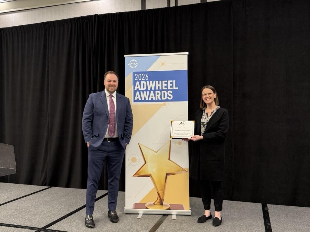 IMAGE: Jeff Pfeifer (left) and Samantha Potter (right) accept award 