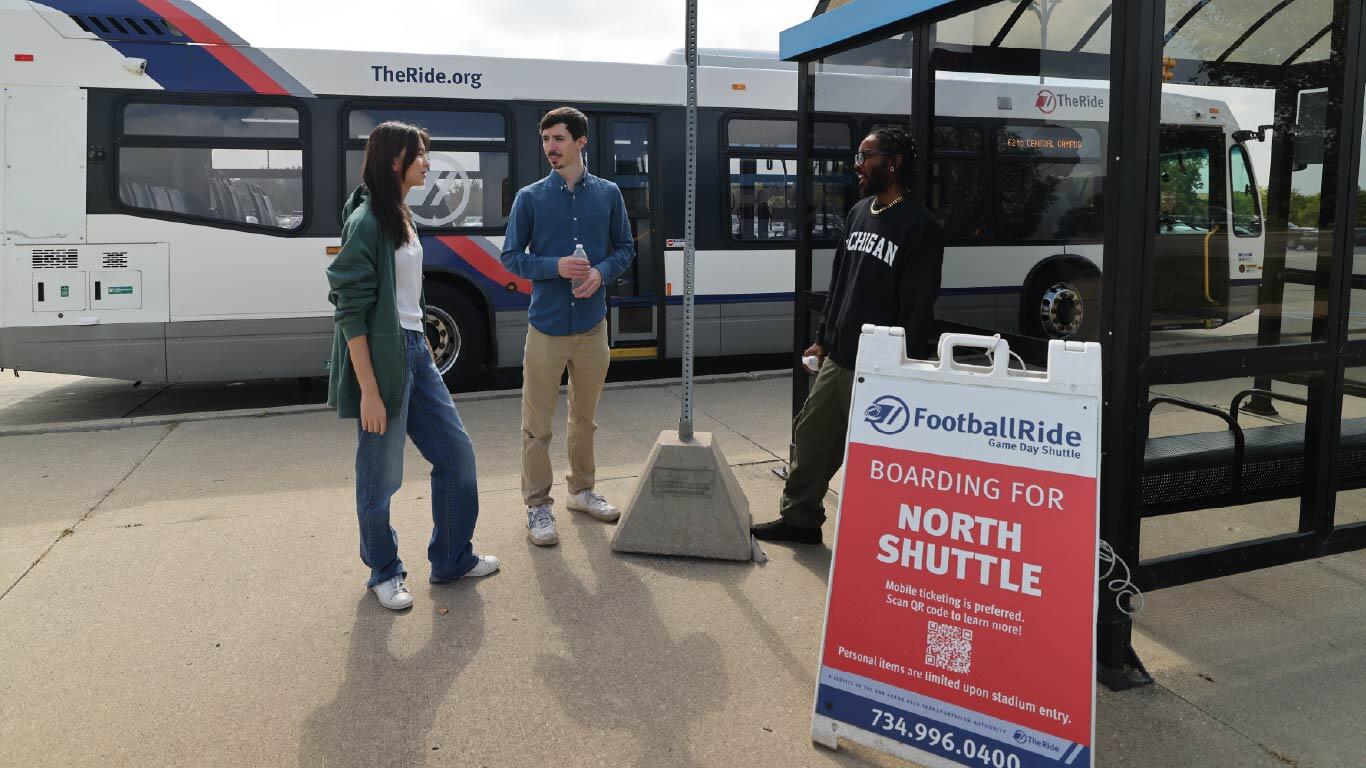 Photo of riders at TheRide's FootballRide North Shuttle Stop on Plymouth Rd.