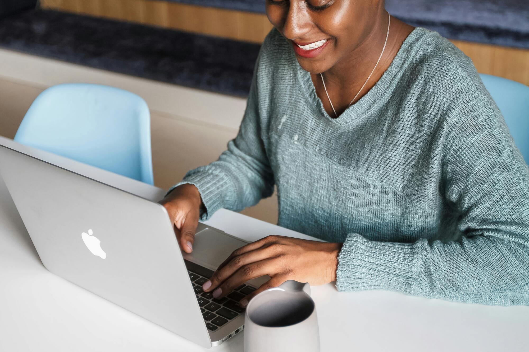Woman typing on laptop