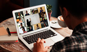 Man in virtual meeting on laptop