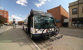 Bus with bike on front.