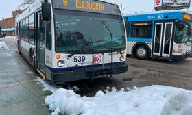 Image of a bus in the snow at the Ypsilanti Transit Center