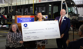 Photo of check being presented to TheRide