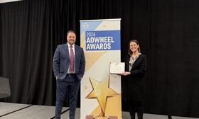 IMAGE: Jeff Pfeifer (left) and Samantha Potter (right) accept award 