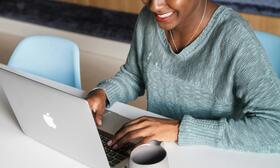 Woman typing on laptop
